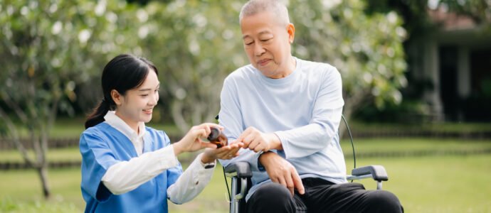 Nurse providing clinical home care and medication management to a senior man, supporting enhanced health and recovery.